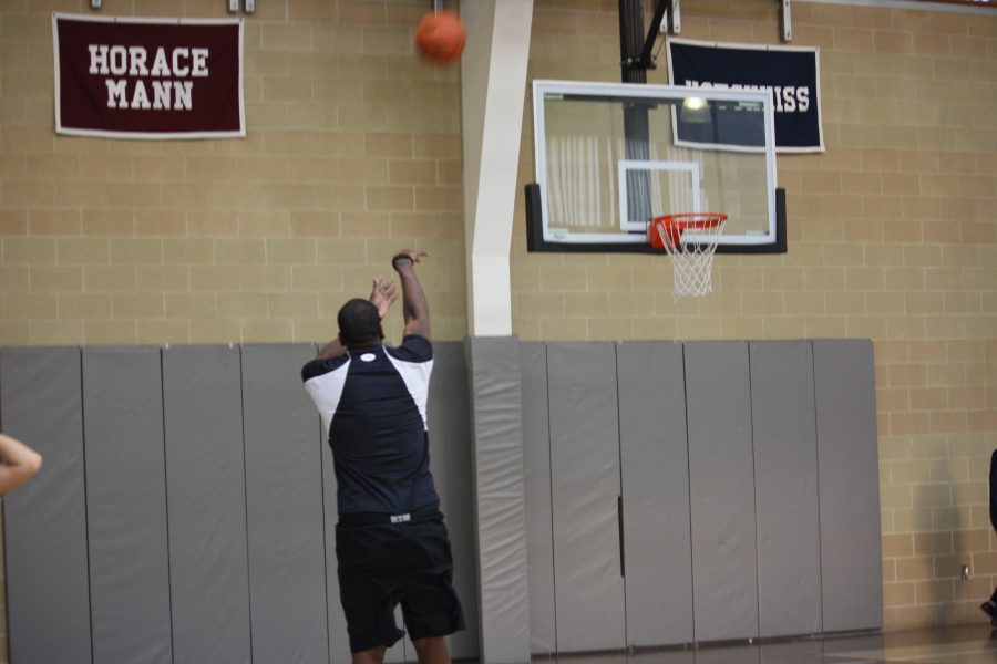 Sean Green, who coaches Convent of the Sacred Heart’s varsity basketball team, shoots a basket and shows he can not only coach, but play the game as well.
courtesy of Alison Brett 13