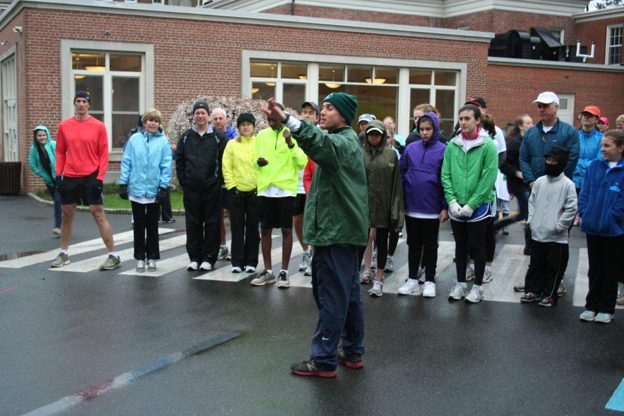 Convent of the Sacred Heart cross country coach Brad Miller helps line up runners at the start of the 2012 race.