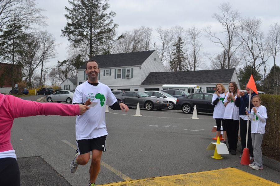 First place winner, Dr. Kevin Donnelly at the finish line of Run for Uganda after completing his 5K run for the benefit of the Sacred Heart secondary sister school in Uganda, Africa.
courtesy of Mrs. Wilson 