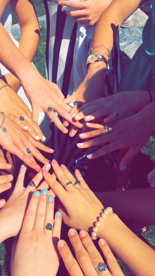 A group of juniors take a photo with their new rings on ring day last year.
Katie Nail 16