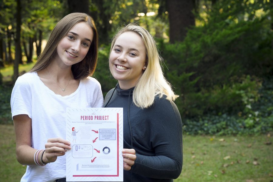 Amy Barratt and Charlotte Hallisey, two Greenwich High School seniors, hold a flier to spread awareness about the need for free menstrual hygiene products in middle and high school bathrooms in Connecticut.  Courtesy of Matthew Brown Hearst Connecticut Media