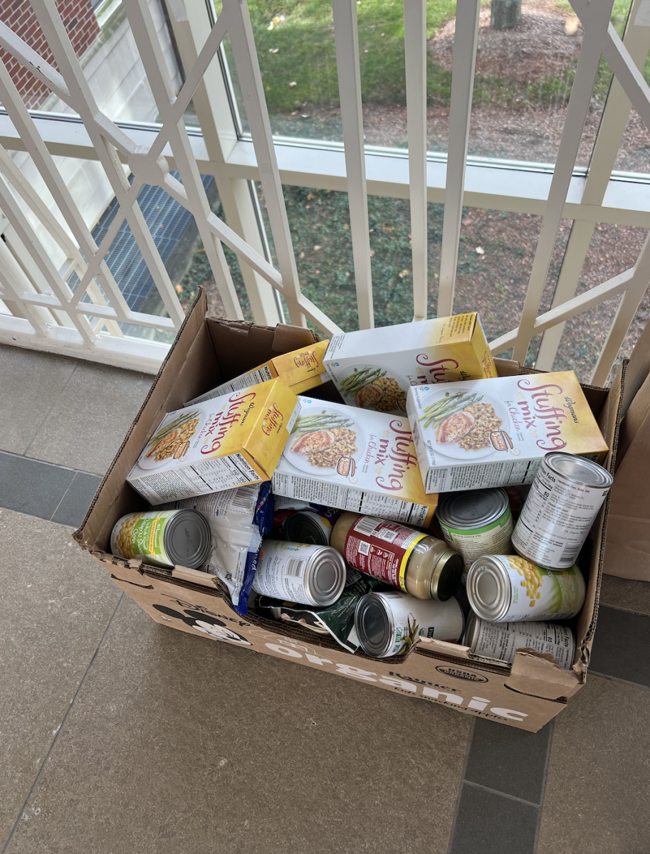 The Sacred Heart Meals on Main Street Club gathers canned Thanksgiving food to donate to Meals on Main Street. 